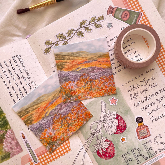 an orange and blue floral hills landscape vinyl sticker by mellow days
