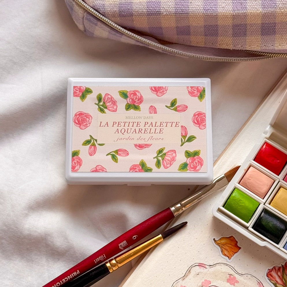 watercolor paint palette with floral design 