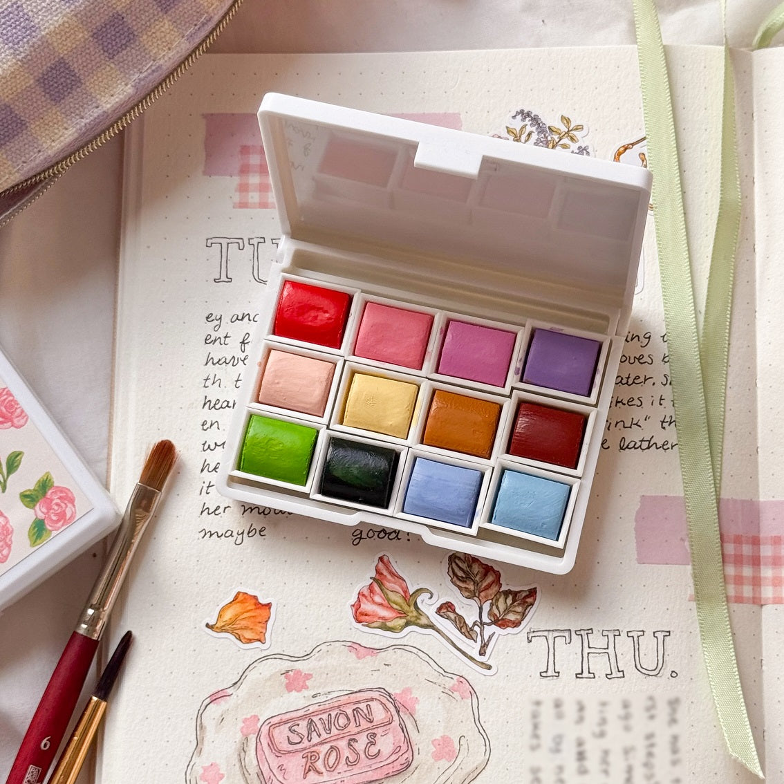 Set of 12 watercolor paints such as red, pink, violet, purple, peach,pastel yellow, ocre yellow, terracotta brown, light green, dark, green, blue, light blue