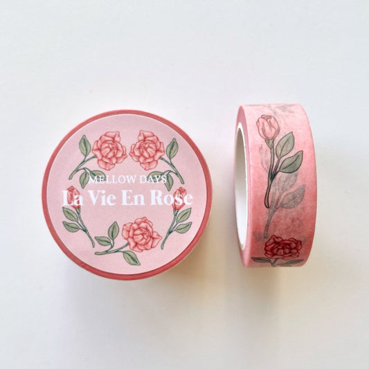 Rose blossom flowers printed on a light pink washi tape, along with the words, La Vie en Rose. 15 mm width by 10 meters length
