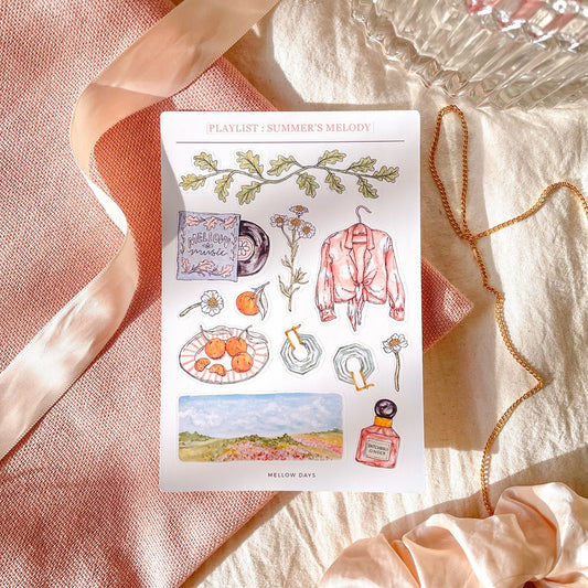 vinyl sticker sheet for bujo, bullet journaling, and stationery planners with Summer theme featuring stickers of leaves, flowers, oranges, vinyl music album, a shirt, earrings, perfume, and a flower landscape
